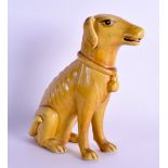 A 19TH CENTURY CHINESE YELLOW GLAZED FIGURE OF A HOUND Kangxi style, modelled standing on its