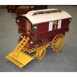 A VINTAGE MODEL OF A GYPSY CARAVAN. 66 cm wide.