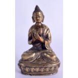 A 19TH CENTURY SOUTH EAST ASIAN BRONZE FIGURE OF A SEATED BUDDHA modelled upon a triangular base.