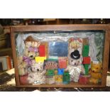 AN EARLY 20TH CENTURY DIORAMA, depicting a family of bears surrounding by advertising in an