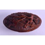 AN EARLY 19TH CENTURY CONTINENTAL CARVED COQUILLA NUT SNUFF BOX decorated with a depiction of