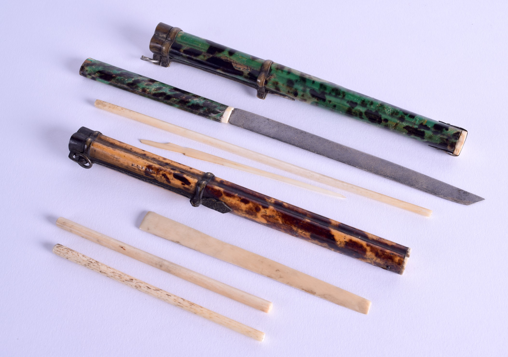 AN UNUSUAL PAIR OF CHINESE QING DYNASTY STAINED TORTOISESHELL TRAVELLING CHOPSTICKS with engraved