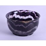 A BLUEJOHN STYLE CIRCULAR CARVED TEABOWL. 6.25 cm diameter.