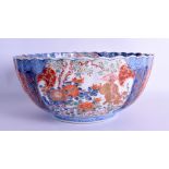 A LARGE EARLY 19TH CENTURY JAPANESE EDO PERIOD IMARI SCALLOPED BOWL painted with buddhistic lions