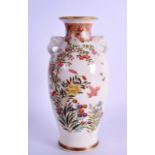 AN EARLY 20TH CENTURY JAPANESE MEIJI PERIOD TWIN HANDKLED SATSUMA VASE painted with flowers. 19 cm