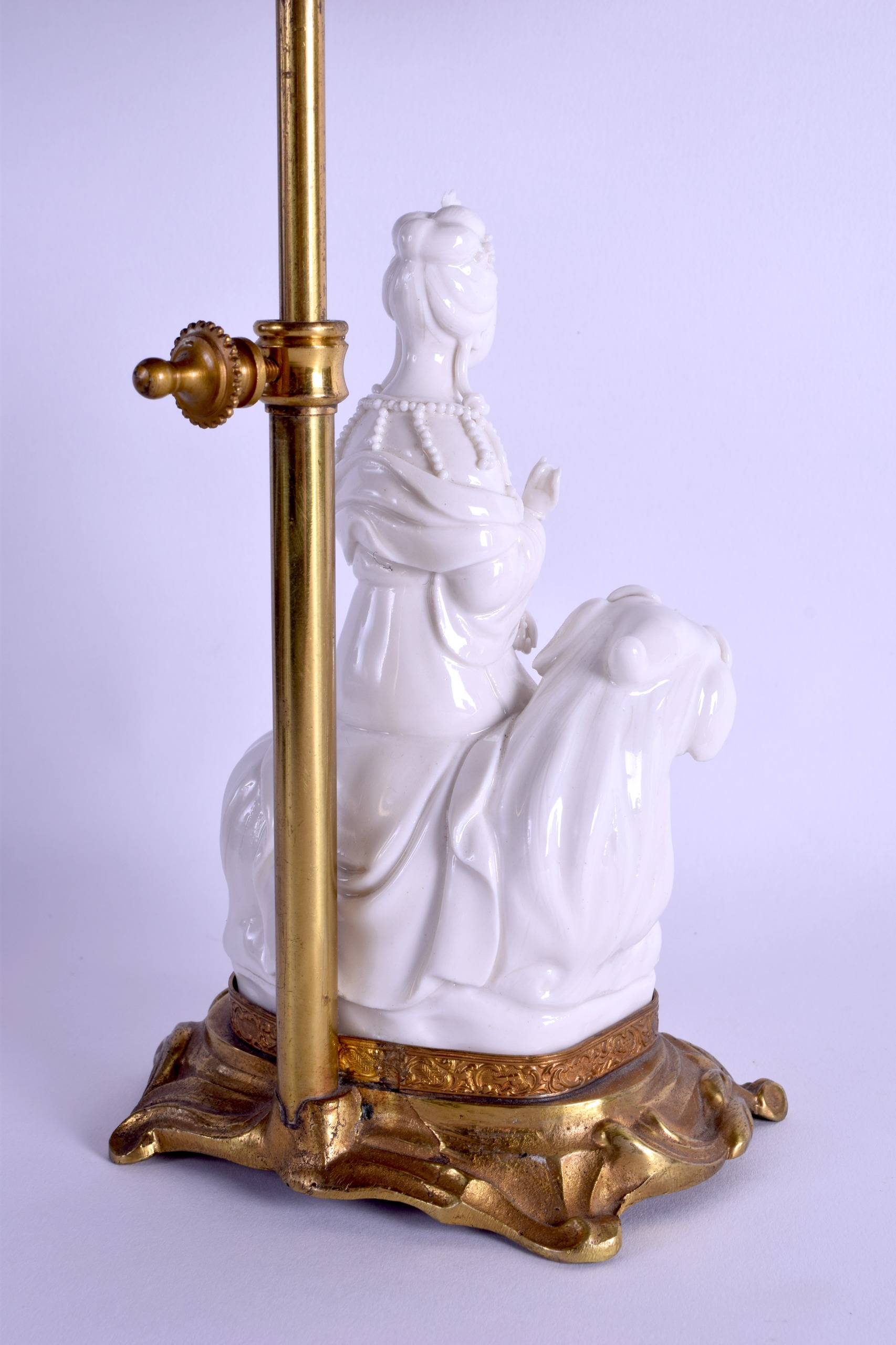 AN EARLY 20TH CENTURY CHINESE BLANC DE CHINE PORCELAIN FIGURE OF GUANYIN converted to a lamp, - Image 3 of 3