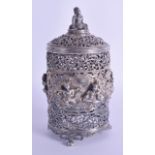 AN UNUSUAL 19TH CENTURY INDIAN WHITE METAL OPENWORK JAR AND COVER decorated in relief with