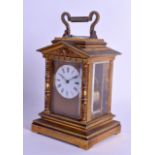 A GOOD 19TH CENTURY FRENCH BRASS REPEATING CARRIAGE CLOCK of architectural form, the circular dial