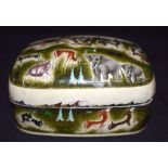 A SMALL PERSIAN LACQUERED BOX, painted with animals in various pursuits. 12 cm wide.