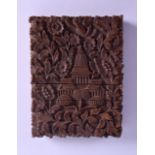 A 19TH CENTURY INDIAN CARVED SANDALWOOD CARD CASE decorated with foliage and birds. 8 cm x 10.75