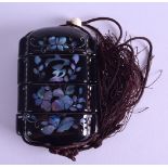 A JAPANESE BLACK LACQUERED FOUR SECTION INRO inlaid with mother of pearl with flowers. 6.5 cm x 8.25