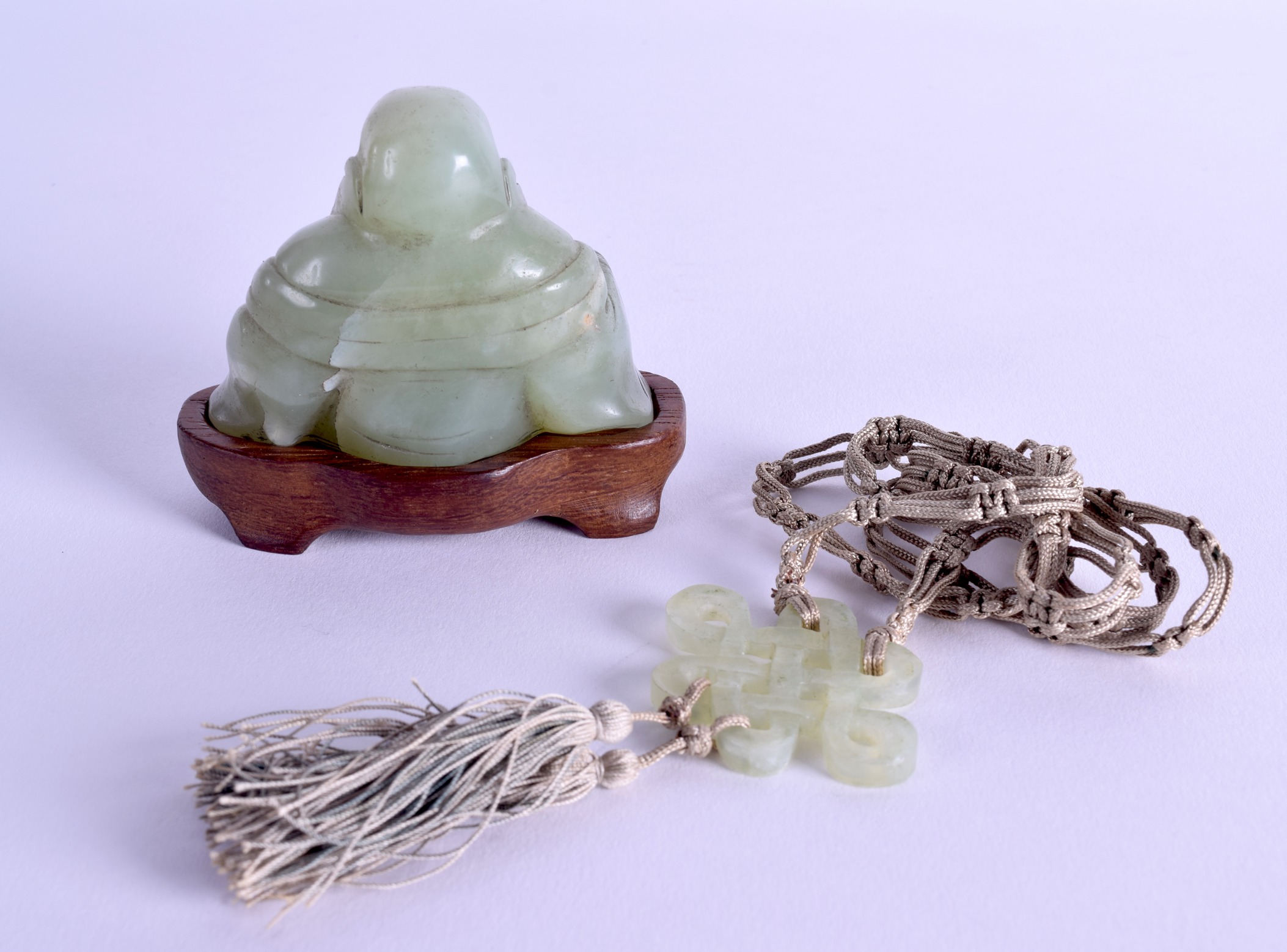 AN EARLY 20TH CENTURY CHINESE CARVED JADE FIGURE OF A BUDDHA together with a hardstone pendant. (2) - Image 2 of 2