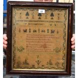 AN EARLY 19TH CENTURY FRAMED SAMPLER by Rebecca Proctor, decorated with trees, flowers and