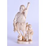 A LATE 19TH CENTURY JAPANESE MEIJI PERIOD CARVED IVORY OKIMONO modelled as a fisherman beside a