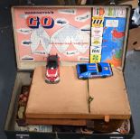 A VINTAGE SUITCASE, containing various vintage games and toys, including table tennis & lotto. (