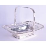AN EDWARDIAN SWING HANDLED SILVER OPEN WORK BASKET of neo classical form. 26 oz. 25 cm wide.