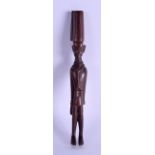 AN UNUSUAL EARLY 20TH CENTURY AFRICAN CARVED WOOD FIGURE OF MALE possibly representing a police