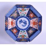 A 19TH CENTURY JAPANESE MEIJI PERIOD IMARI BLUE AND WHITE OCTAGONAL DISH painted with flowers. 21 cm