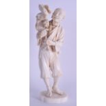 A LATE 19TH CENTURY JAPANESE MEIJI PERIOD CARVED IVORY OKIMONO modelled as a male holding aloft a