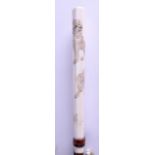 A LATE 19TH CENTURY JAPANESE MEIJI PERIOD CARVED IVORY PARASOL HANDLE decorated with lions and