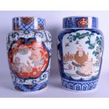 A PAIR OF 19TH CENTURY JAPANESE MEIJI PERIOD IMARI VASES painted with immortals within landscapes.