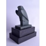 AN EGYPTIAN GRAND TOUR STYLE FIGURE OF A HORUS BIRD modelled upon an ebonised wooden base. Bird 14