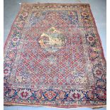 A GOOD EARLY 20TH CENTURY CAUCASION RUG, with central panel depicting animals. 194 cm x 140 cm.