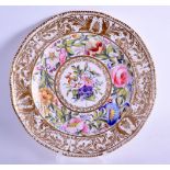 AN EARLY 19TH CENTURY DERBY KING STREET PORCELAIN PLATE painted with flowers under a rich gilt