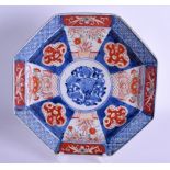 A 19TH CENTURY JAPANESE MEIJI PERIOD OCTAGONAL IMARI DISH painted with flowers. 23 cm wide.