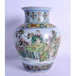 AN EARLY 20TH CENTURY CHINESE FAMILLE VERTE BULBOUS VASE painted with immortals within landscapes.