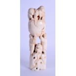 A 19TH CENTURY JAPANESE MEIJI PERIOD CARVED IVORY OKIMONO modelled as a group of monkeys holding