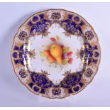 Royal Worcester plate painted with fruit under a blue and gilt border by Albert Shuck, signed date