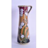 A MOORCROFT 'LILY OF THE VALLEY' JUG designed by Emma Bossons. 18.5 cm high.