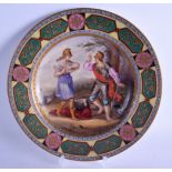 A 19TH CENTURY VIENNA PORCELAIN CABINET PLATE painted with two figures within a landscape. 24.5 cm