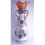 A HUGE 19TH CENTURY JAPAENSE MEIJI PERIOD TWIN HANDLED KUTANI FLOOR VASE painted with figures and