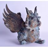 A SOUTH EAST ASIAN BRONZE FIGURE OF A BUDDHISTIC BEAST modelled with wings outstretched. 22 cm