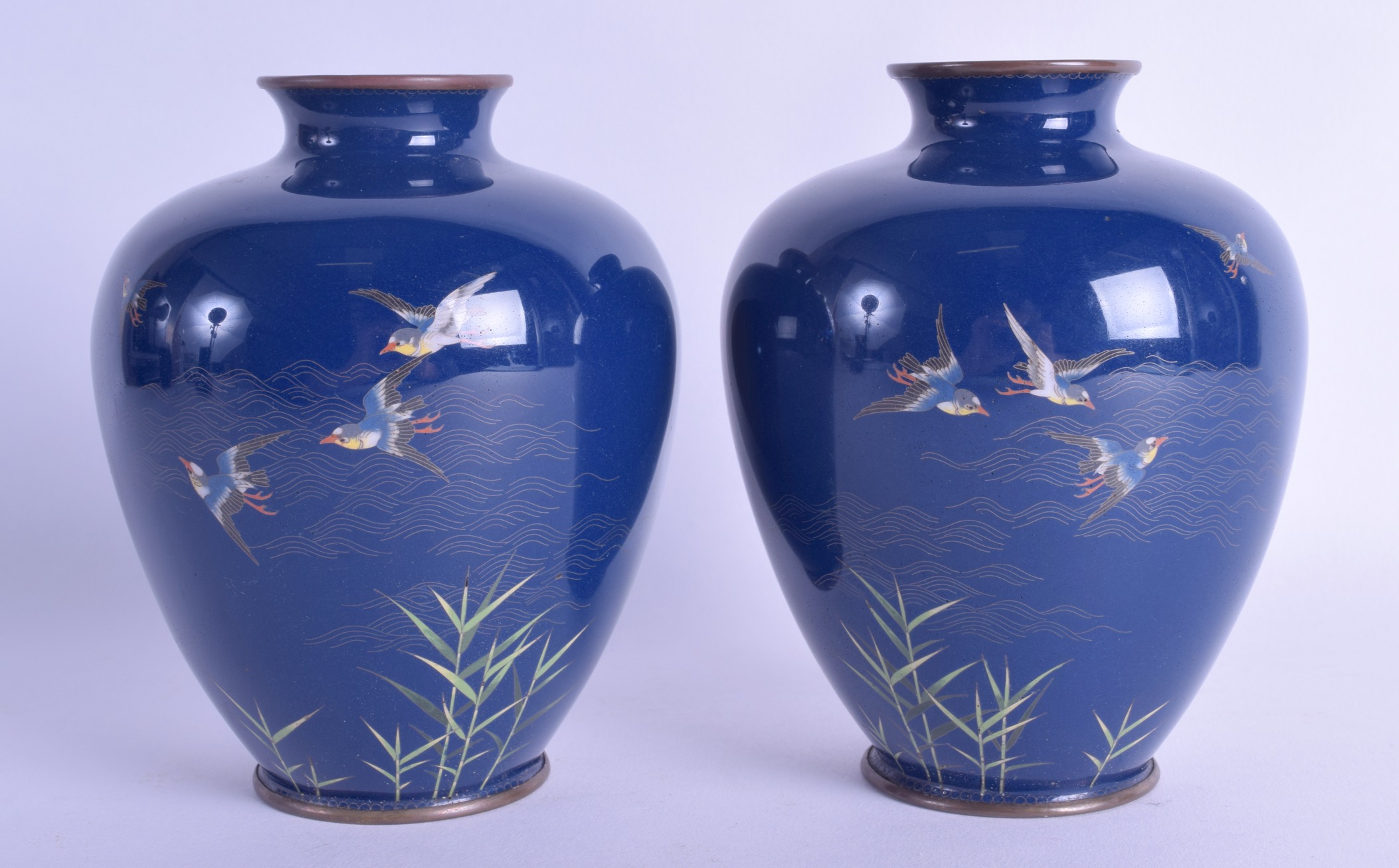 A PAIR OF LATE 19TH CENTURY CHINESE CLOISONNE ENAMEL JARS decorated with silver inlaid birds in