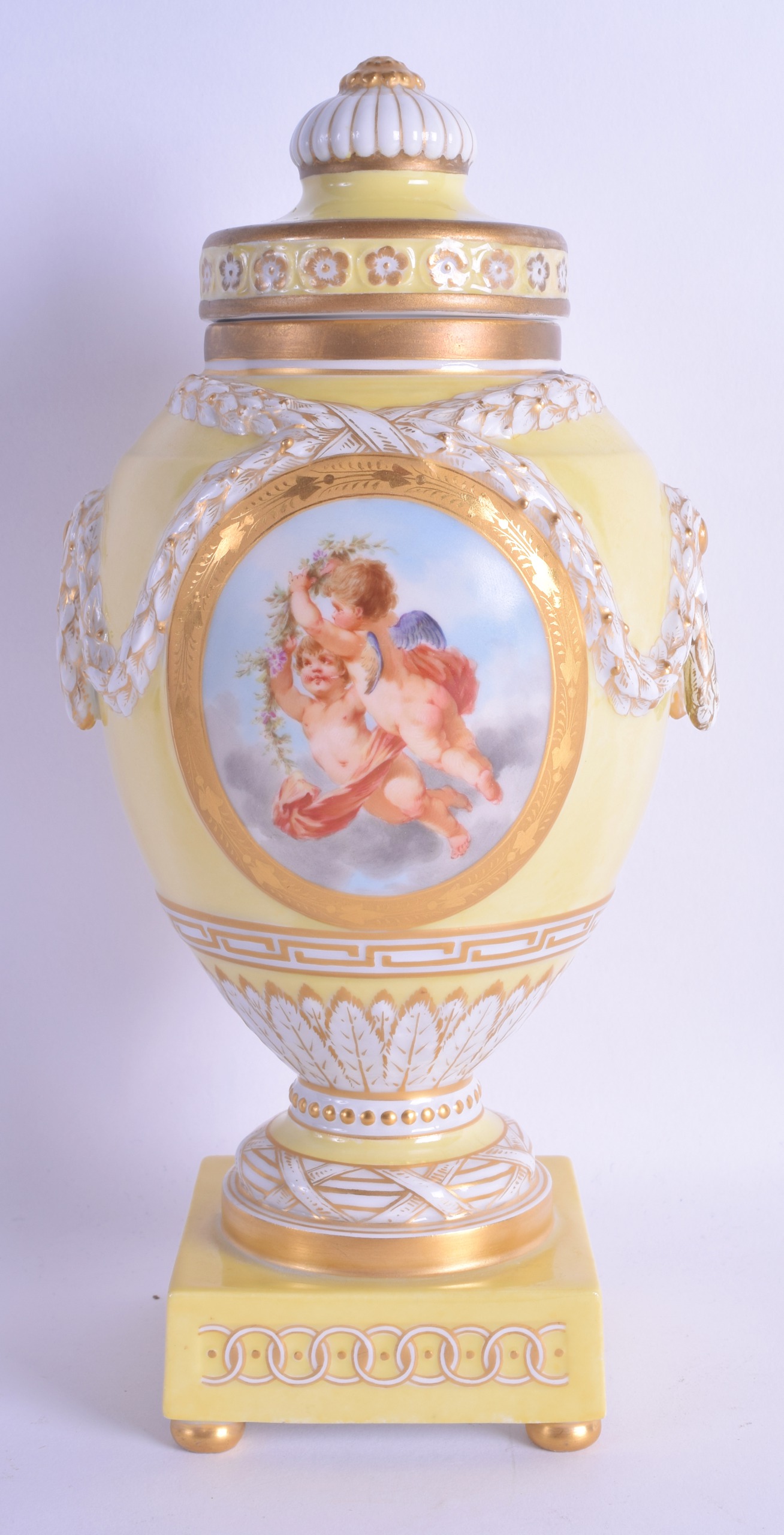 A FINE 19TH CENTURY KPM BERLIN YELLOW VASE AND COVER painted with two putti amongst clouds. 25 cm