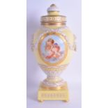 A FINE 19TH CENTURY KPM BERLIN YELLOW VASE AND COVER painted with two putti amongst clouds. 25 cm