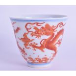 A CHINESE IRON RED PORCELAIN TEABOWL bearing Yongzheng marks to base, painted with dragons. 5.5 cm