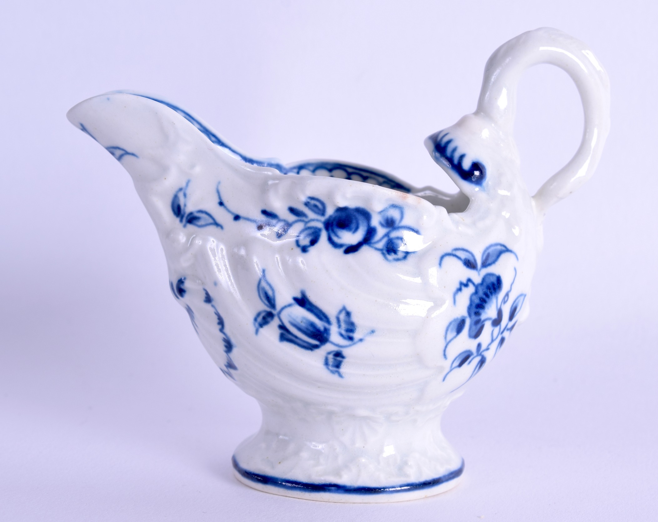 18th c. Worcester dolphin moulded ewer with lamprey handle painted with flowers in underglaze