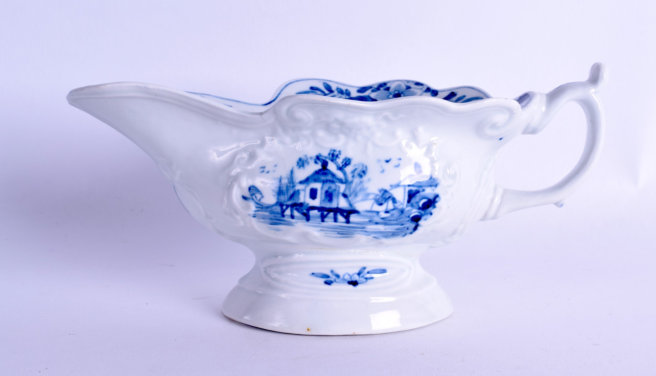 18th c. Worcester sauceboat of high footed silver shape painted with the uncommon Triangular