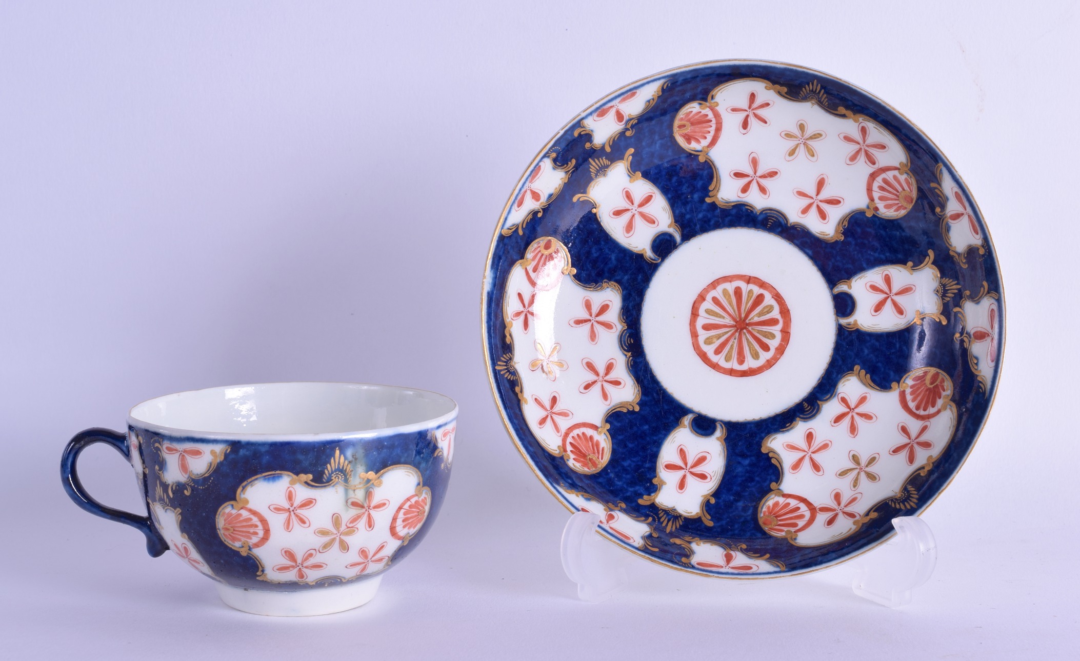 18th c. Worcester teacup and saucer painted with the Old Japan Star pattern on a blue scale