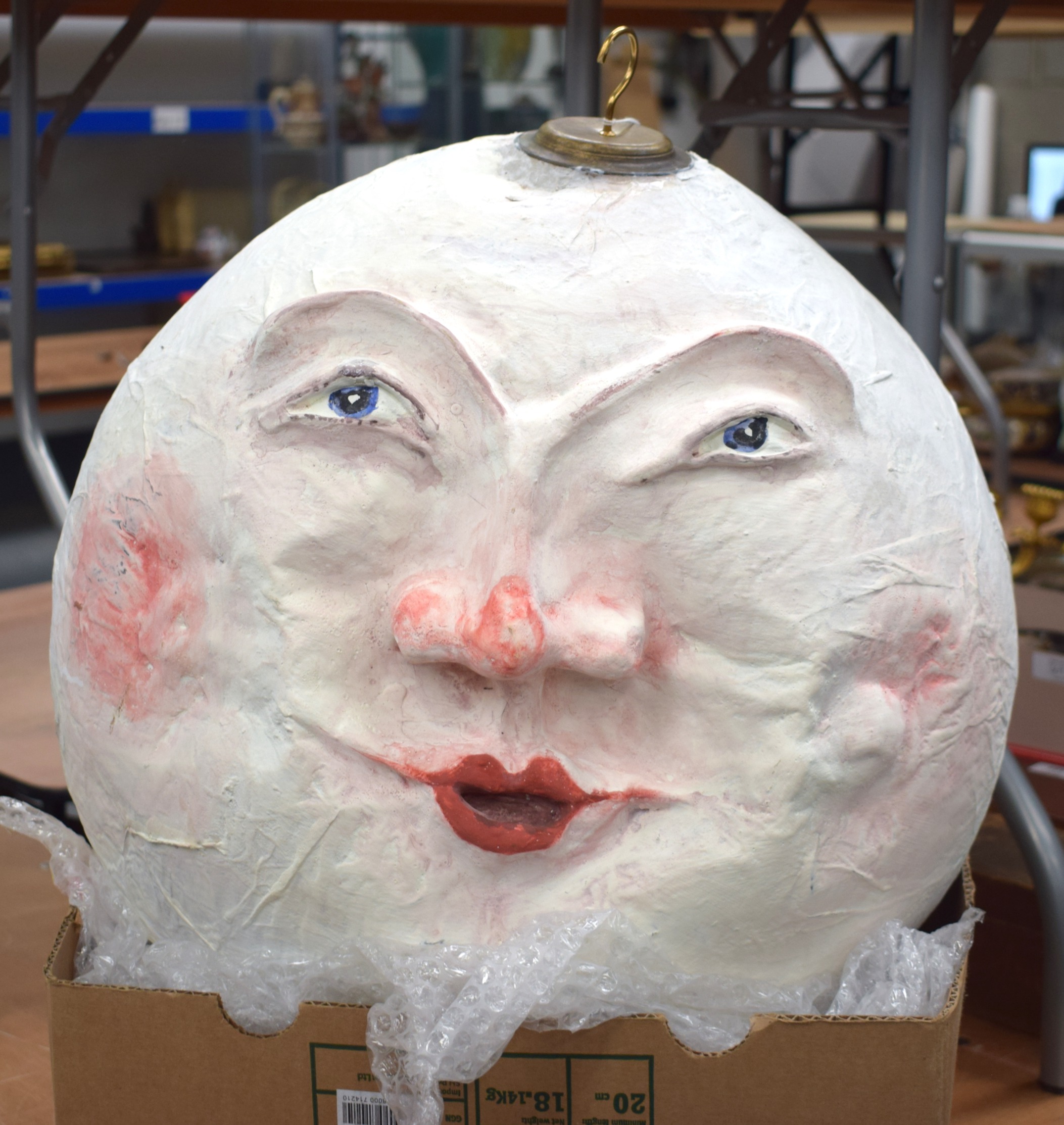 AN UNUSUAL PAPIER MACHE MOON HEAD HANGING LANTERN. 42 cm x 42 cm.