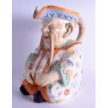 A LARGE LATE 19TH CENTURY EUROPEAN POTTERY FIGURAL CHARACTER JUG stamped W & R, modelled as a seated