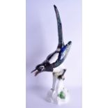 A VERY LARGE 19TH CENTURY MEISSEN FIGURE OF A MAGPIE after J J Kaendler, modelled squawking upon a