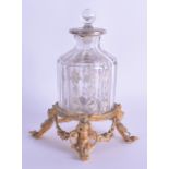 A GOOD EARLY 19TH CENTURY FRENCH ORMOLU SILVER INLAID CRYSTAL BOTTLE AND STOPPER modelled upon a