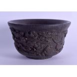 A CHINESE CARVED HARDWOOD CIRCULAR BOWL bearing Kangxi marks to base, decorated with flowering