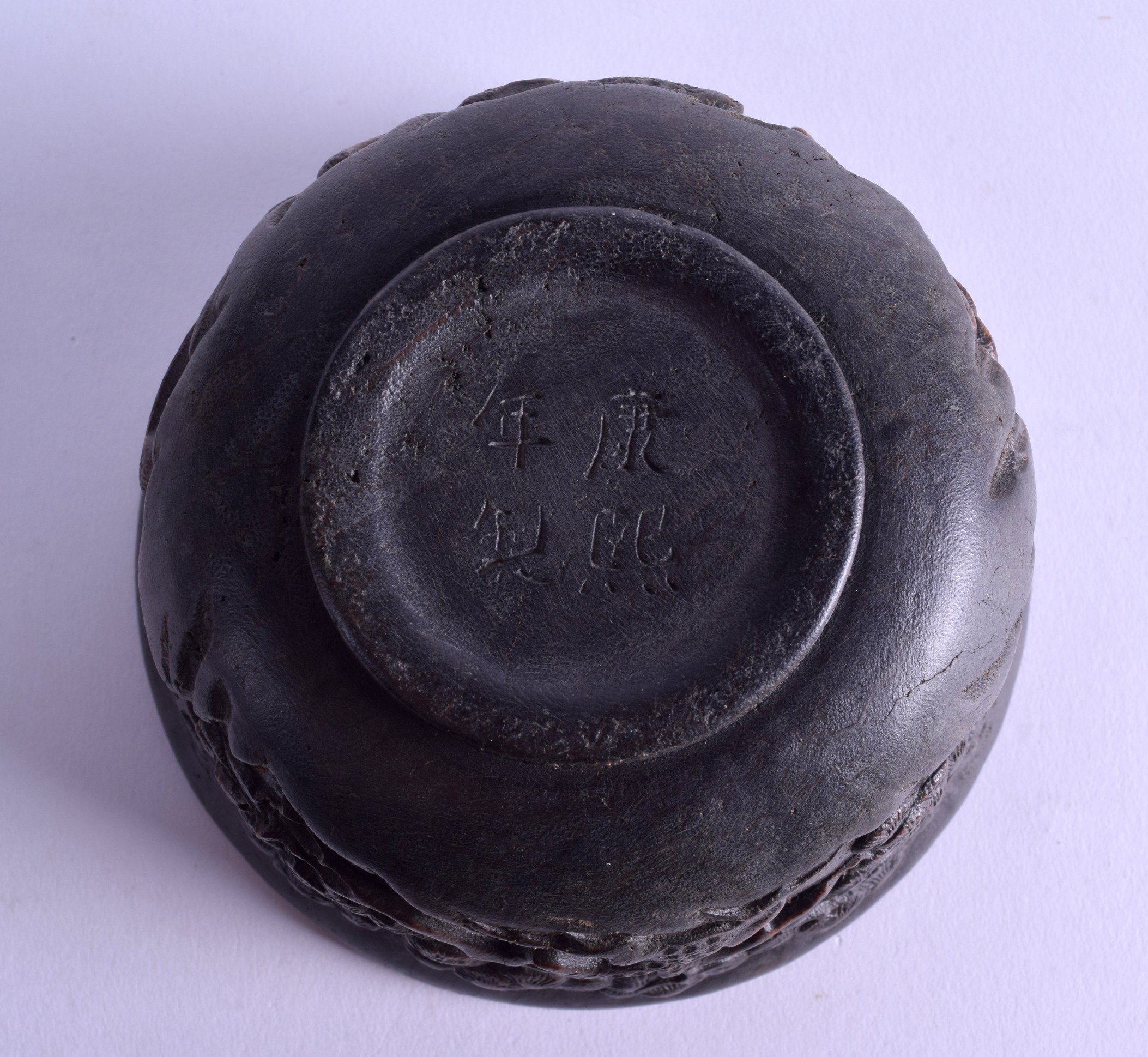 A CHINESE CARVED HARDWOOD CIRCULAR BOWL bearing Kangxi marks to base, decorated with flowering - Image 3 of 3