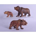 A FAMILY OF THREE LATE 19TH CENTURY BAVARIAN BLACK FOREST BEARS modelled in roaming stances. Largest